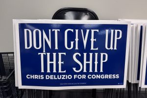 blue yard sign that says Dont' Give Up the Ship Chris Deluzio for Congress