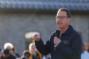 Josh Shapiro addresses the crowd outdoors